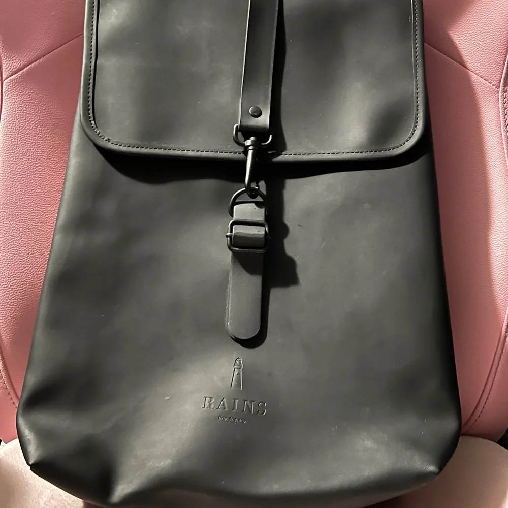 Rains Black Matte Roll-Top Backpack - Picture 1 of 2